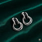 Bold Elegance – Silver & Black Stone Hoop Earrings